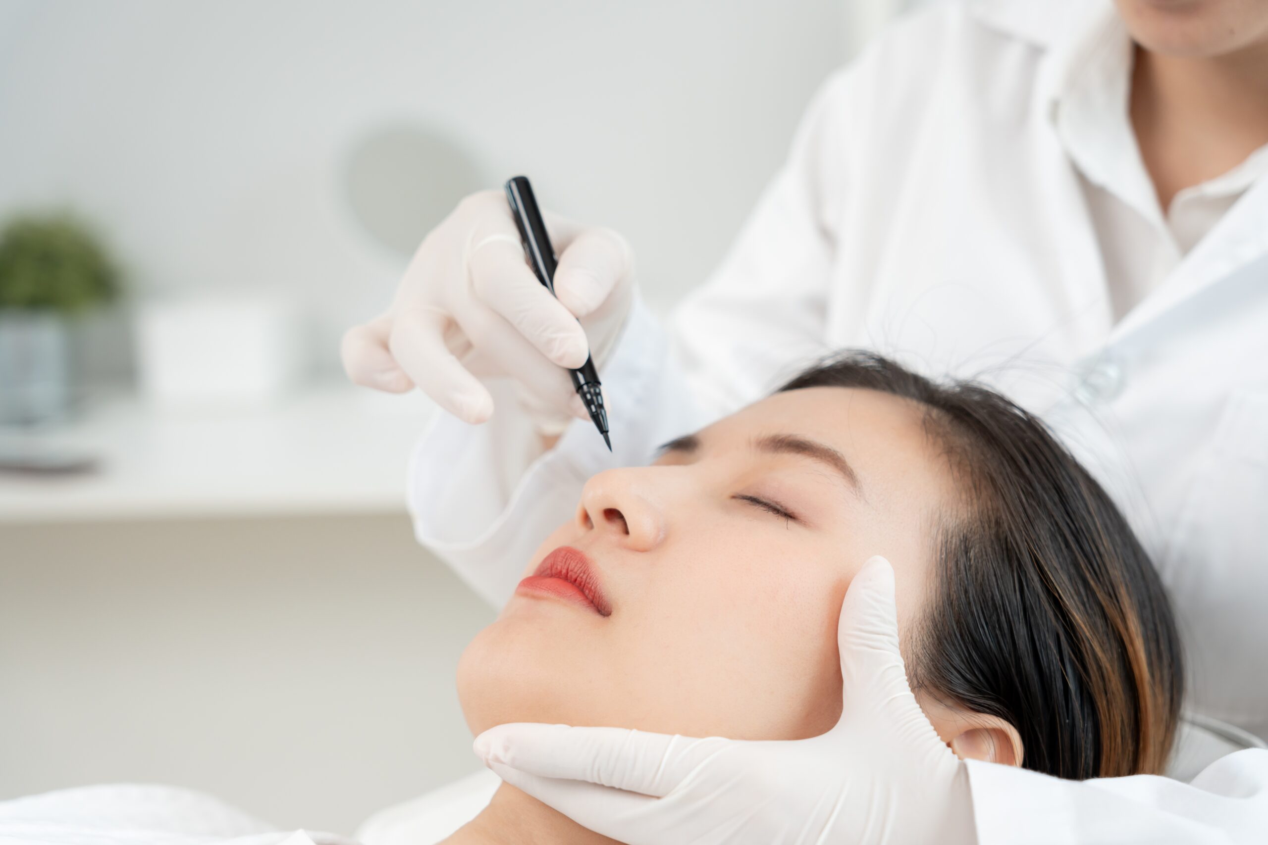Plastic,Surgery,,Beauty,,Surgeon,Or,Beautician,Touching,Woman,Face,,Surgical